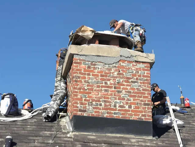 New Britain Chimney Sweep installing a custom chimney crown in New Britain, CT