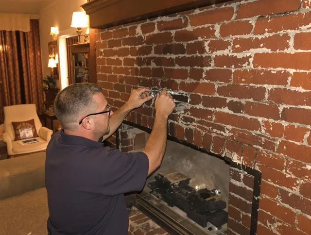 New Britain Chimney Sweep expert fixing a fireplace in New Britain, CT